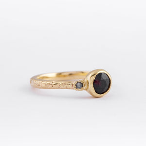 Solid 9ct yellow gold with dark red garnet and salt and pepper diamond