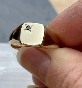 Solid gold signet ring with black diamond